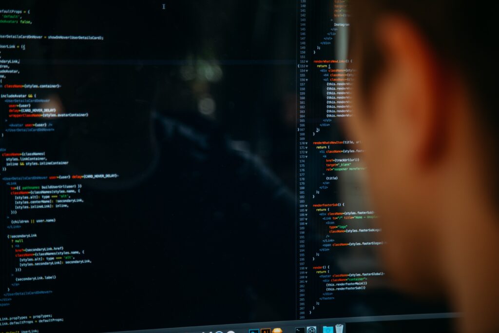 a person staring at a screen full of code